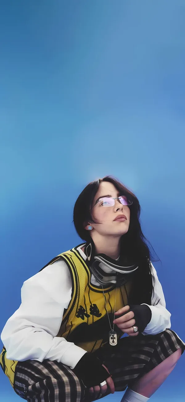 تصویر زمینه بیلی آیلیش با لباس‌های گشاد و اسپرت